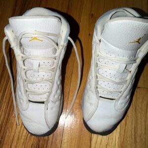 Nike Kids White Sneakers with Gold Jumpman Accent